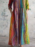 Damenkleid aus Baumwolle mit V-Ausschnitt und buntem geometrischem Muster, mit Taschen