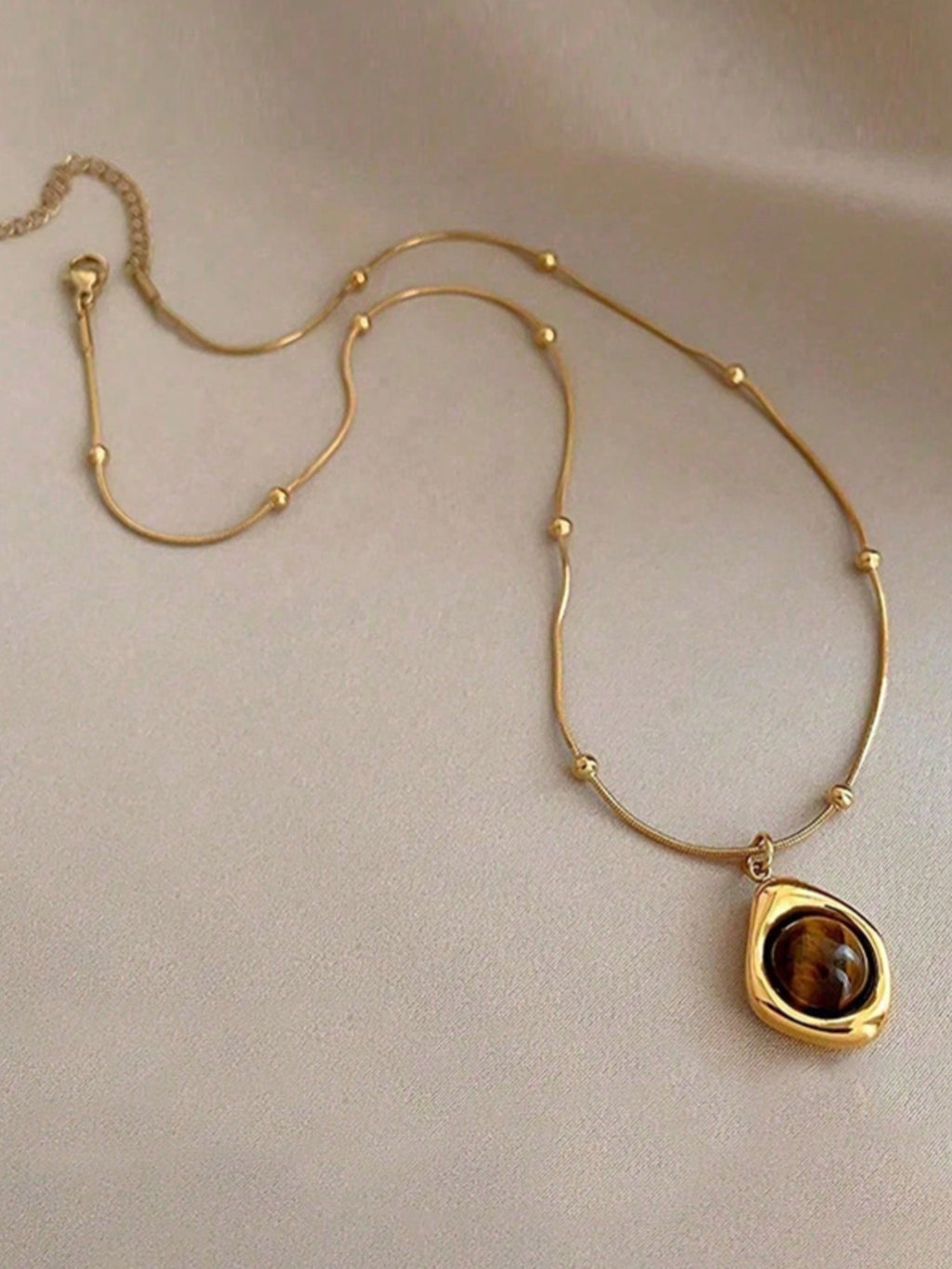 Festival Accessory — Golden Earth-Tone Stone Pendant Necklace