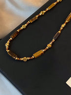 Festival Accessory — Golden Earth-Tone Stone Pendant Necklace