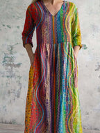 Damenkleid aus Baumwolle mit V-Ausschnitt und buntem geometrischem Muster, mit Taschen