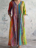 Damenkleid aus Baumwolle mit V-Ausschnitt und buntem geometrischem Muster, mit Taschen