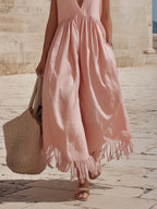 vacation style dusty pink deep v neck gathered waist fringe hem wide leg jumpsuit