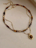 Festival Accessory — Golden Earth-Tone Stone Pendant Necklace